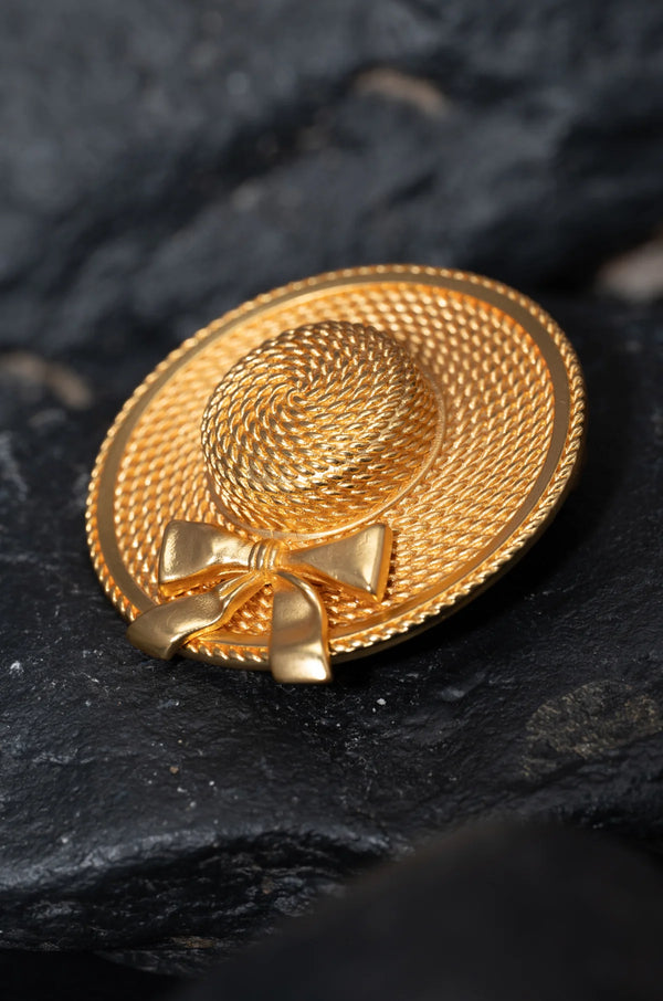 Broche à breloques dorées