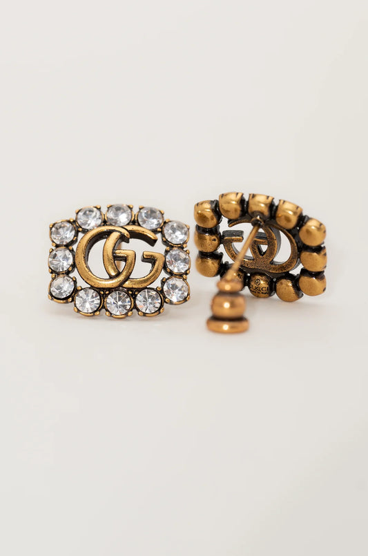 Clous d'oreilles en cristal symboliques